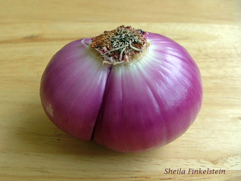 red onion with most of outer layers peeled away