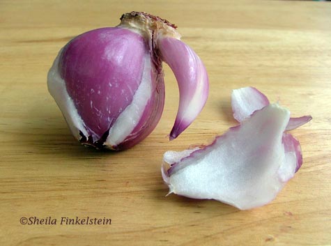 Another view of Red onion peeling away layers 2 and layer 8